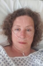 Living kidney donor Julie lying down in hospital